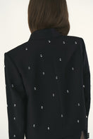 Black Kris Marán shorten jewelry blazer jacket shown from the back, featuring a tailored fit and sleek design.