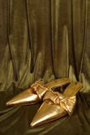 Gold tinfoil nappa side-tie mule heels by House of Atana, featuring a sleek design and stylish ankle ties.
