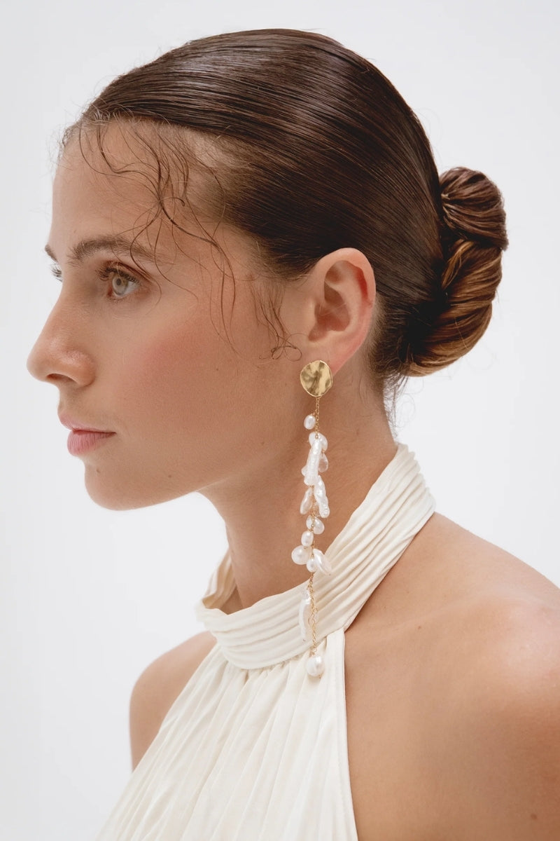 LAVANI JEWELS Siena pearl earrings showcasing elegant white pearls with silver hooks on a white background.