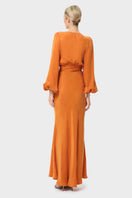niLuu Sienna Maia wrap top in beige, showing the back with a stylish wrap design and long sleeves.