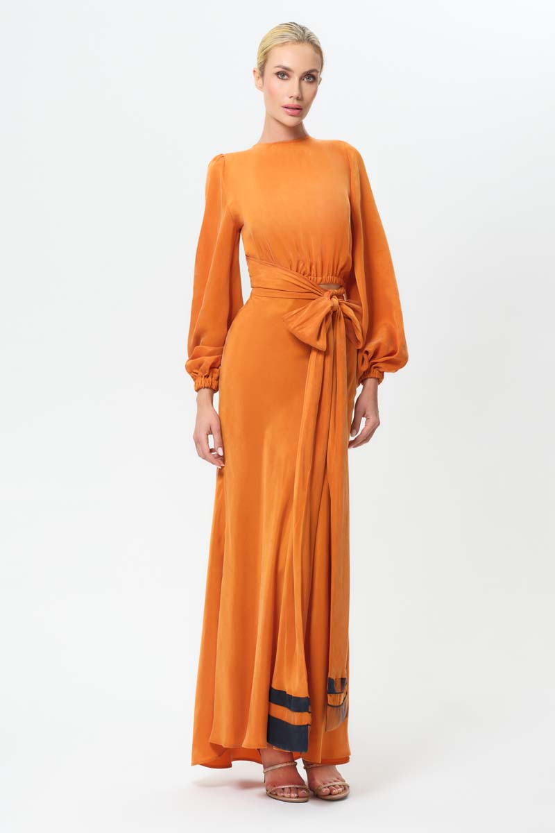 NiLuu Sienna Lucy slip maxi skirt with a flowing silhouette, shown with a wrap top in a neutral tone.