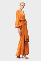 niLuu Sienna Maia wrap top, stylish women's top with a wrap design, shown from the side in this image.