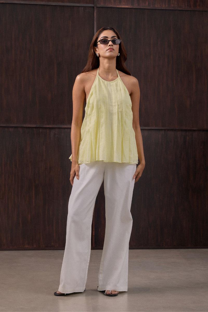 Bright yellow Sierra top from Summer Away in canary color, featuring a relaxed fit and sleeveless design.