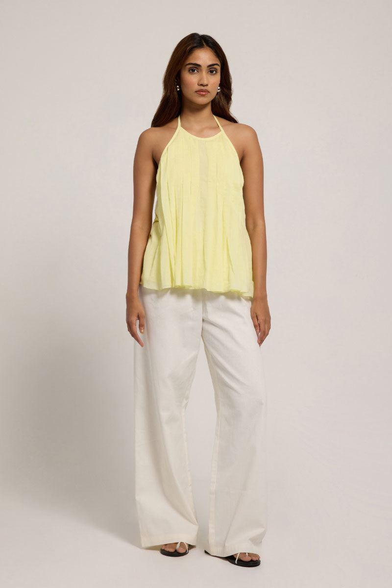 Bright yellow Sierra top from Summer Away in Canary color, featuring a stylish sleeveless design and lightweight fabric.