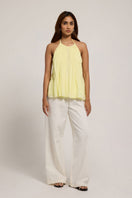 Bright yellow Sierra top in Canary by Summer Away, featuring a stylish sleeveless design and lightweight fabric for warm weather.