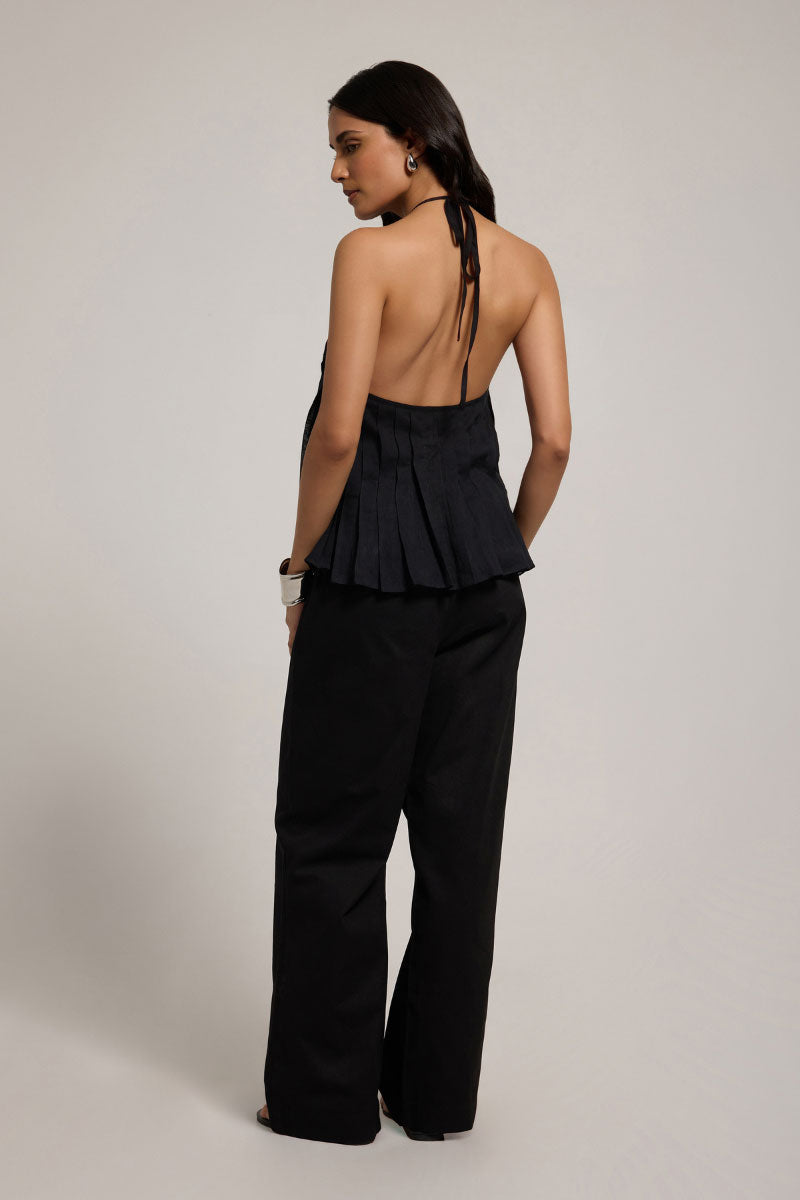 Black Sierra Top by Summer Away, a stylish women's sleeveless blouse with a relaxed fit and modern design.