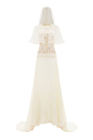 Pastel yellow POEM Seiste gown with ghostly design, flowing fabric, and elegant silhouette, perfect for formal occasions.