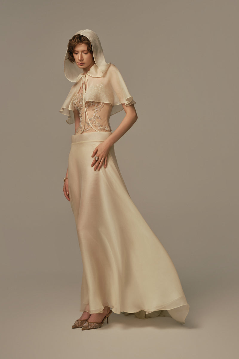 Pastel yellow POEM SEISTE MAXI DRESS on model, flowing fabric, sleeveless design, elegant and comfortable maxi dress style.