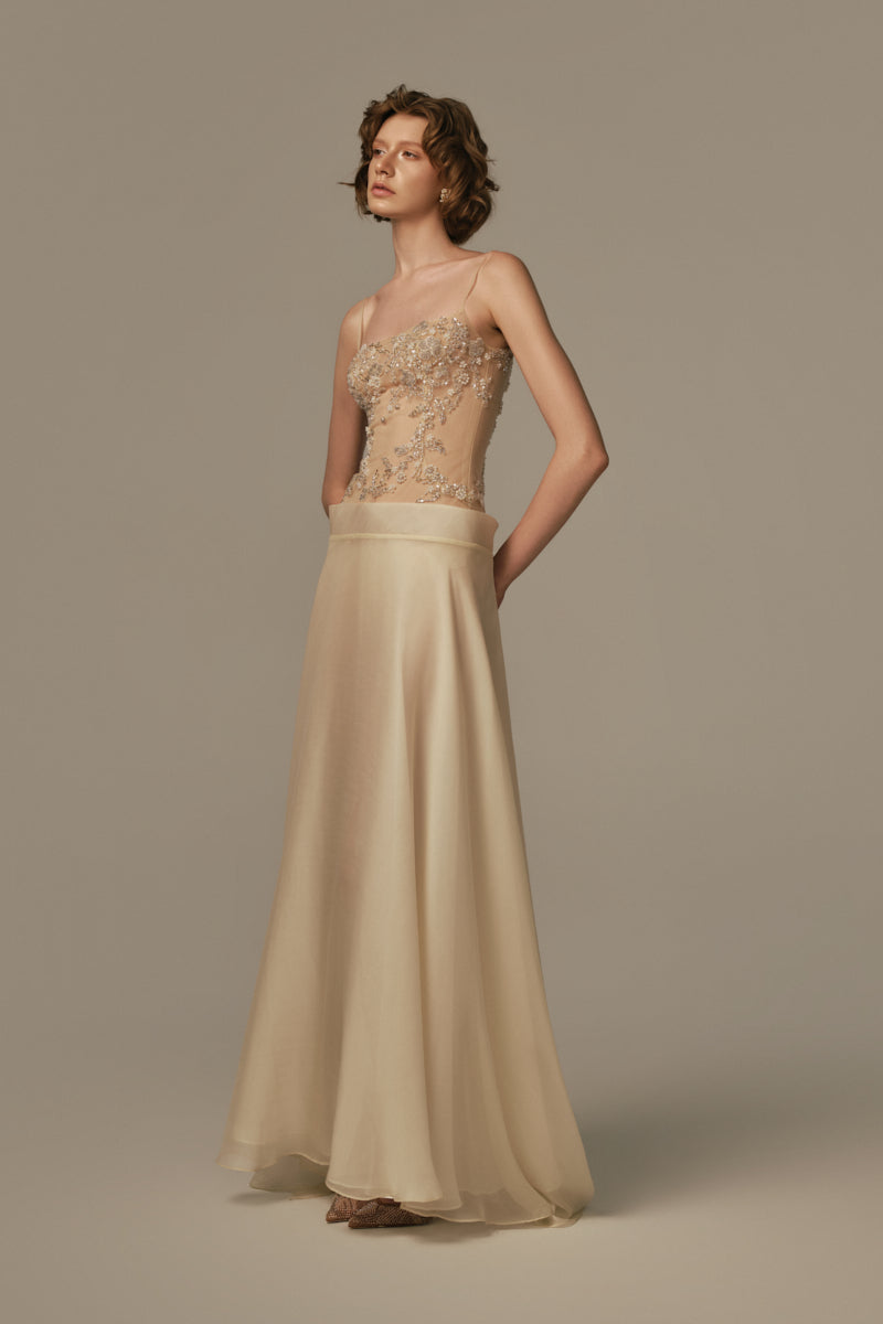 Poem Sieste Maxi Dress in pastel yellow, flowing maxi dress with elegant fit, worn by model in a stylish fashion shoot.