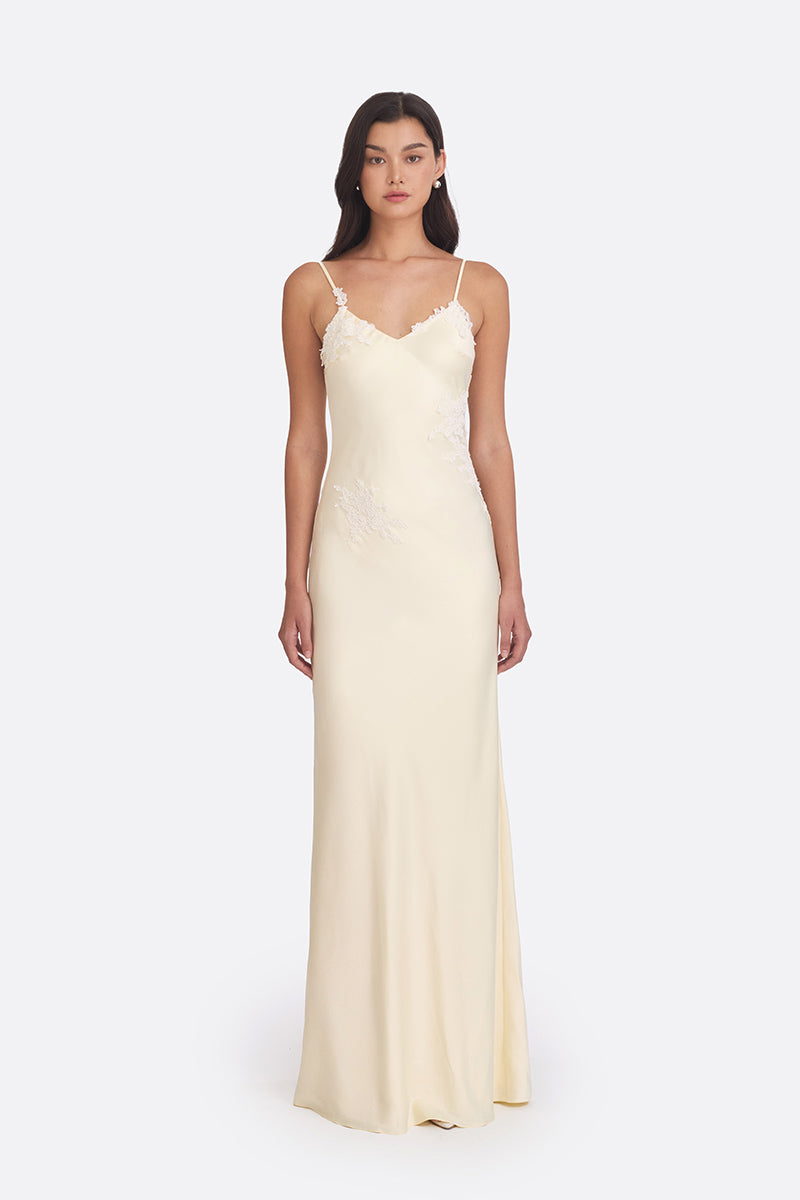 Light yellow Signature V-neck maxi dress by Stolen Stores, featuring a flowing silhouette and elegant design.