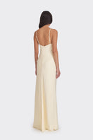 Light yellow Stolen Stores V-neck maxi dress with a flowing silhouette, perfect for elegant summer occasions.