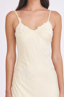 Light yellow Signature V-neck maxi dress by Stolen Stores, flowing fabric, and elegant design perfect for summer occasions.