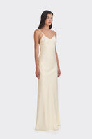 Light yellow Signature V-neck maxi dress by Stolen Stores, featuring a flowing silhouette and elegant design.