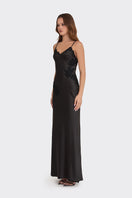 Black Stolen Stores maxi dress with V-neck and lace details, featuring a sleek, elegant design in a flowing silhouette.