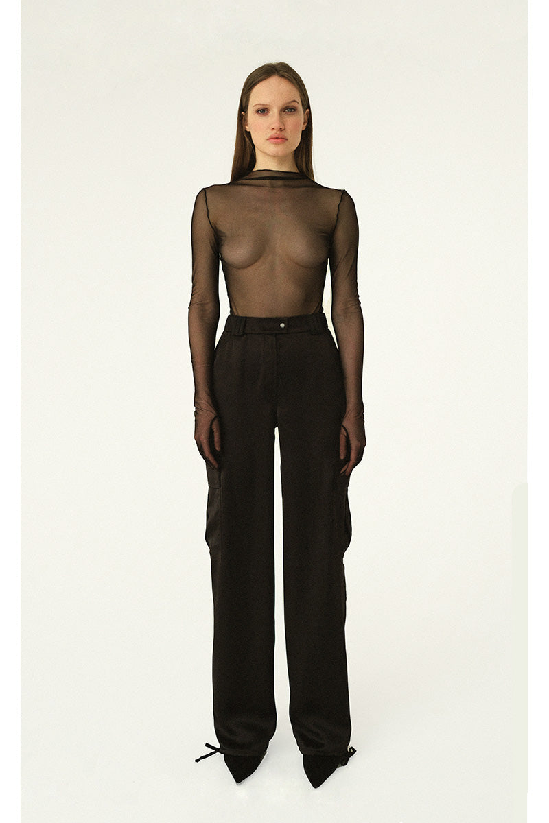 Black silky cargo pants with soldier-style pockets by Kris Marán, featuring a relaxed fit and functional pocket design.