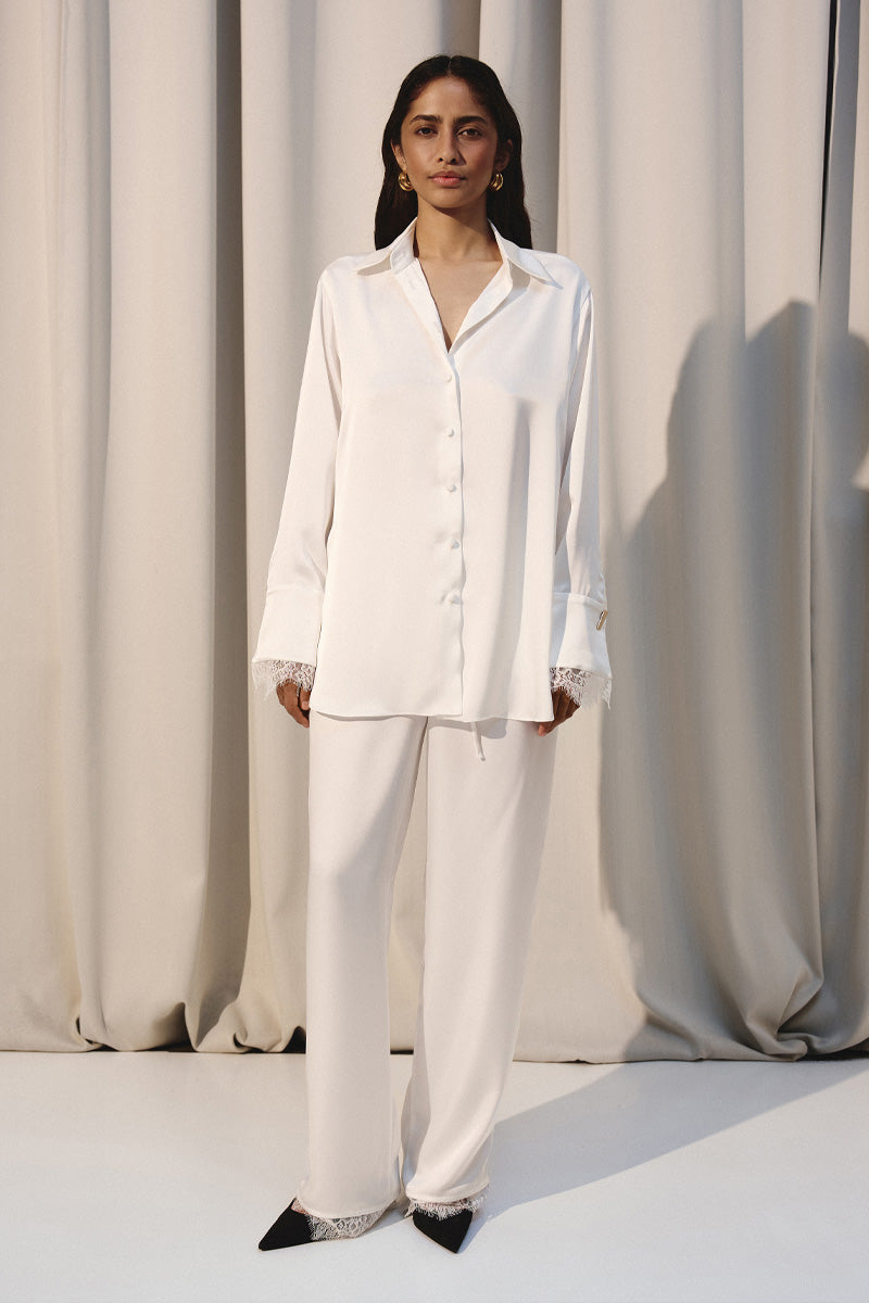 Ivory silky Kris Marán lounge shirt with lace detailing, featuring a relaxed fit and elegant design for comfortable style.