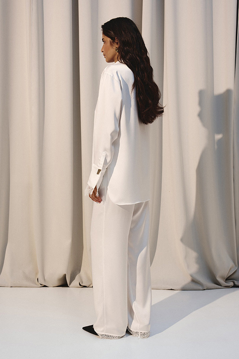 Ivory silky lounge shirt with lace accents by Kris Marán, featuring a relaxed fit and delicate lace details on the sleeves.
