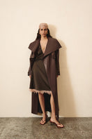 Brown silk midi skirt with lace detailing by Kris Marán, featuring a smooth fabric and elegant design.