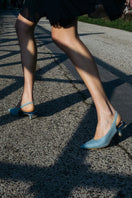 A pair of AERA Silvana blue denim slingback pumps heels with pointed toes and a stylish, casual denim finish.