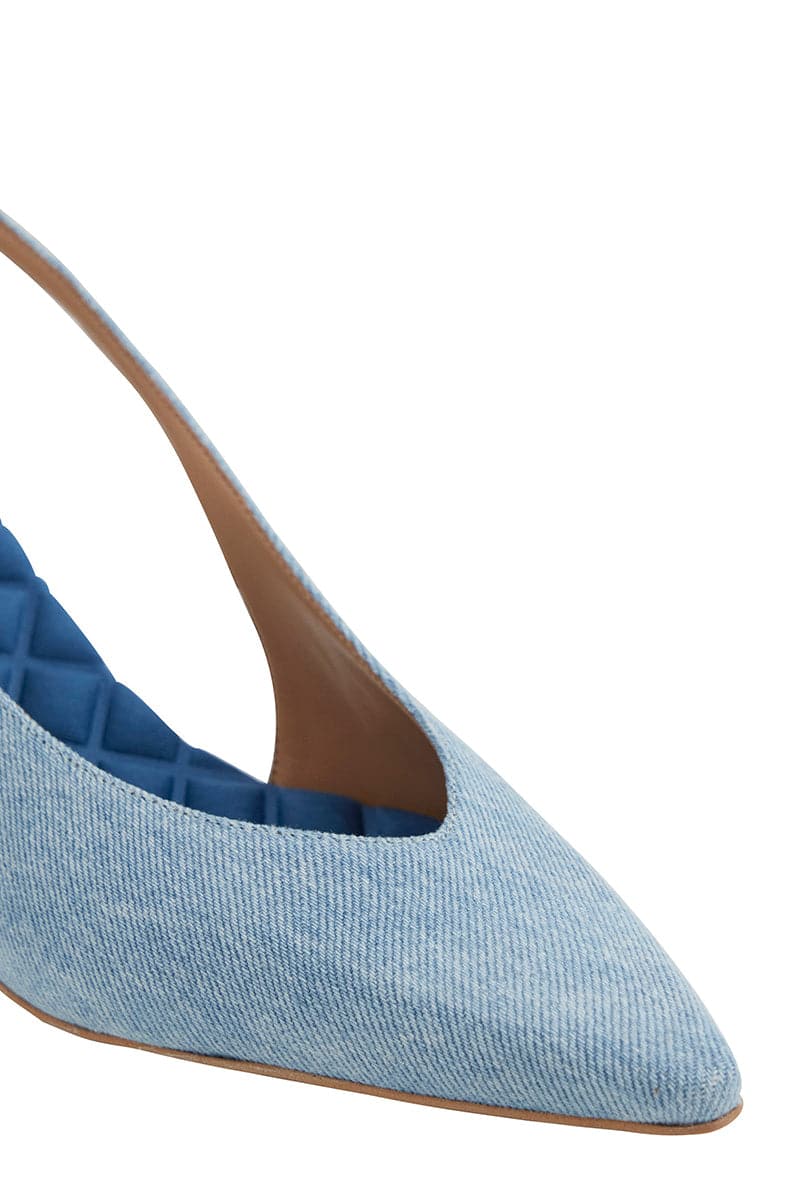 A pair of AERA Silvana blue denim slingback pumps with pointed toes and stylish heel, displayed from the front view.