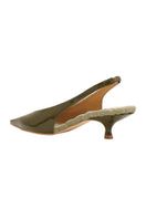 A pair of AERA Silvana green patent-effect slingback pumps shown from the back, featuring pointed heels and elegant design.