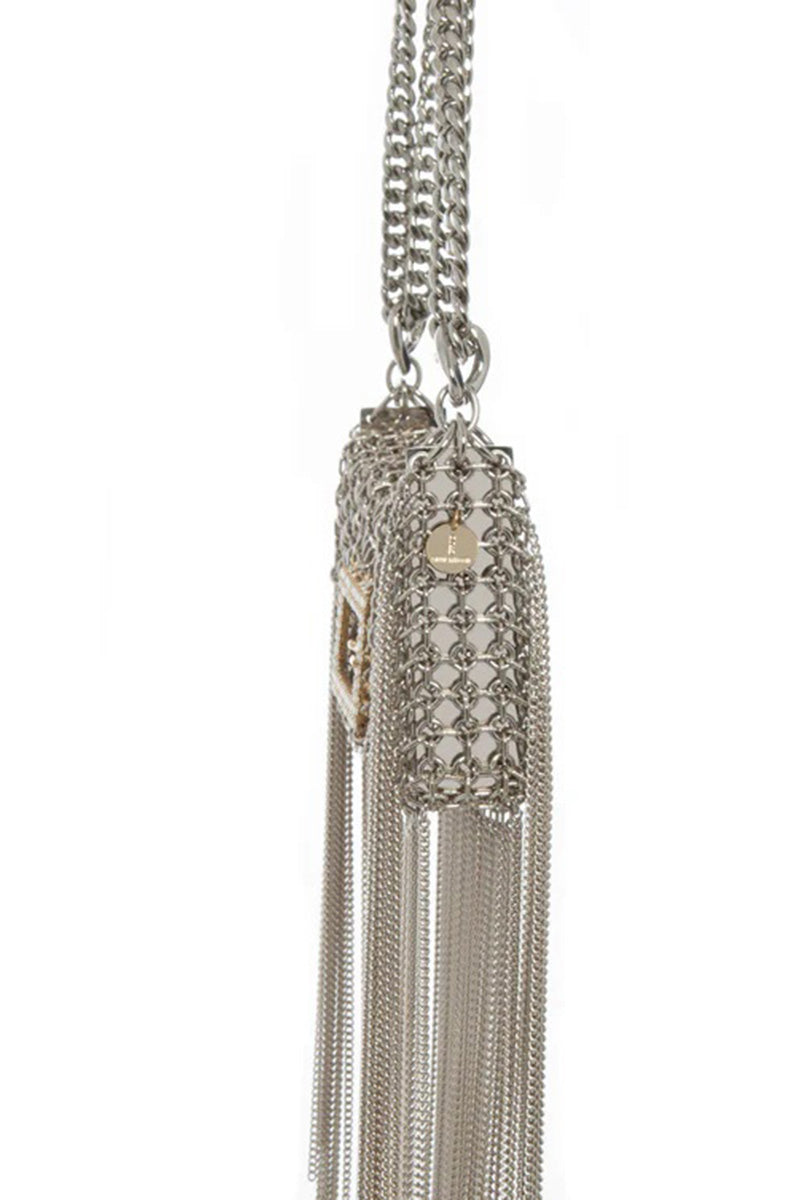 Silver shoulder bag named The Baby Rodeo by Silvia Gnecchi, featuring a sleek metallic finish and stylish design.