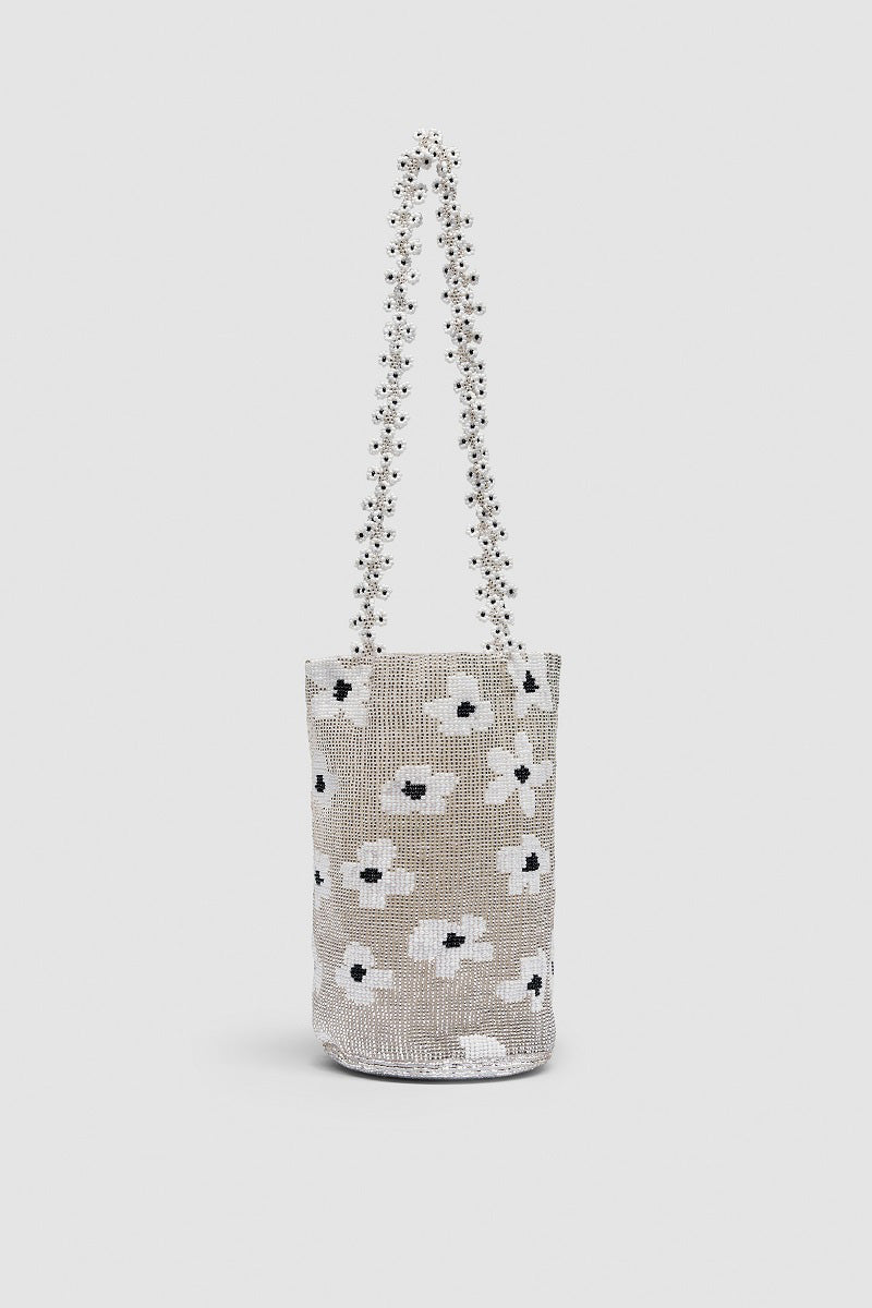 Silver Pura Utz shoulder bag with a silver flower design, featuring a sleek, stylish look perfect for everyday or evening wear.
