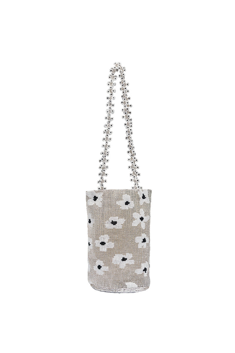 Silver flower dream shoulder bag by Pura Utz featuring a silver floral design and stylish strap.