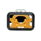 Black Sy&Vie Simetrís Curves mirror clutch with sleek design and curved shape, perfect for stylish evening accessories.