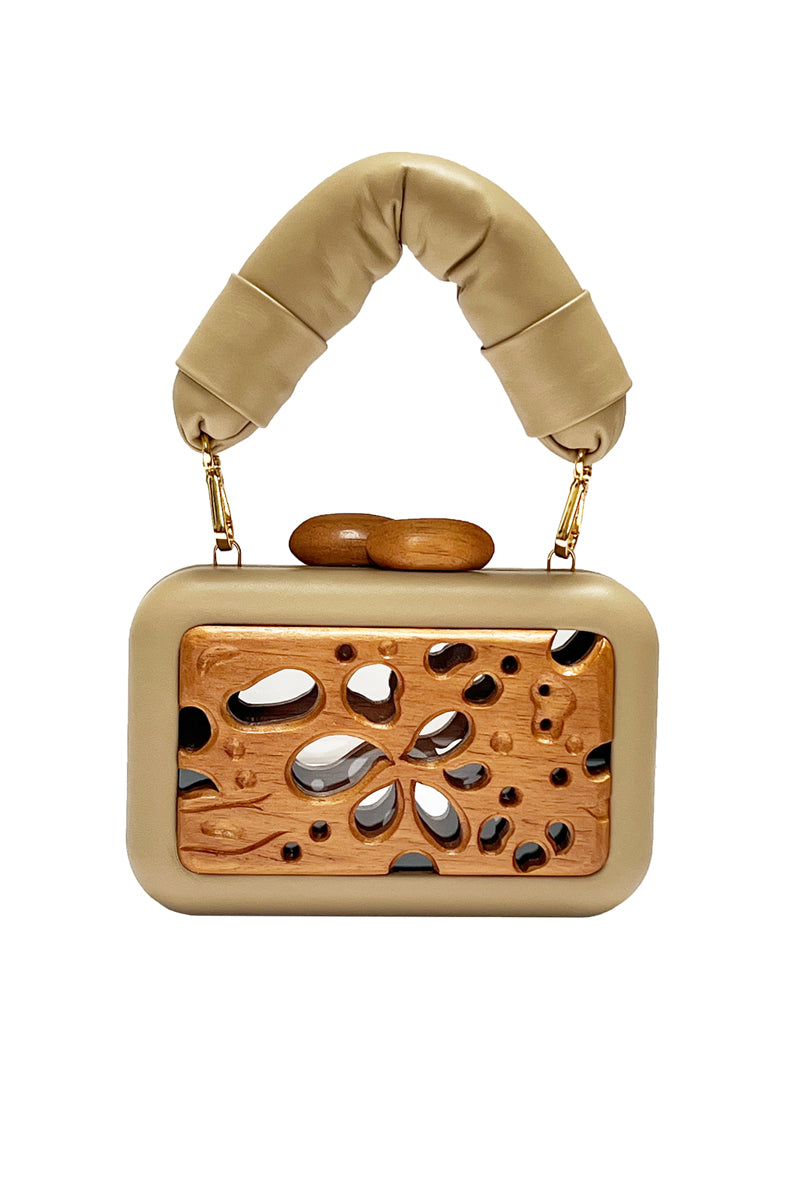 Beige acrylic clutch with honeycomb pattern by Sy&Vie, featuring a sleek, modern design perfect for stylish occasions.