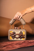 Olive green Sy&Vie Simetrís Isometra clutch with geometric design, soft texture, and compact size for elegant evening accessories.