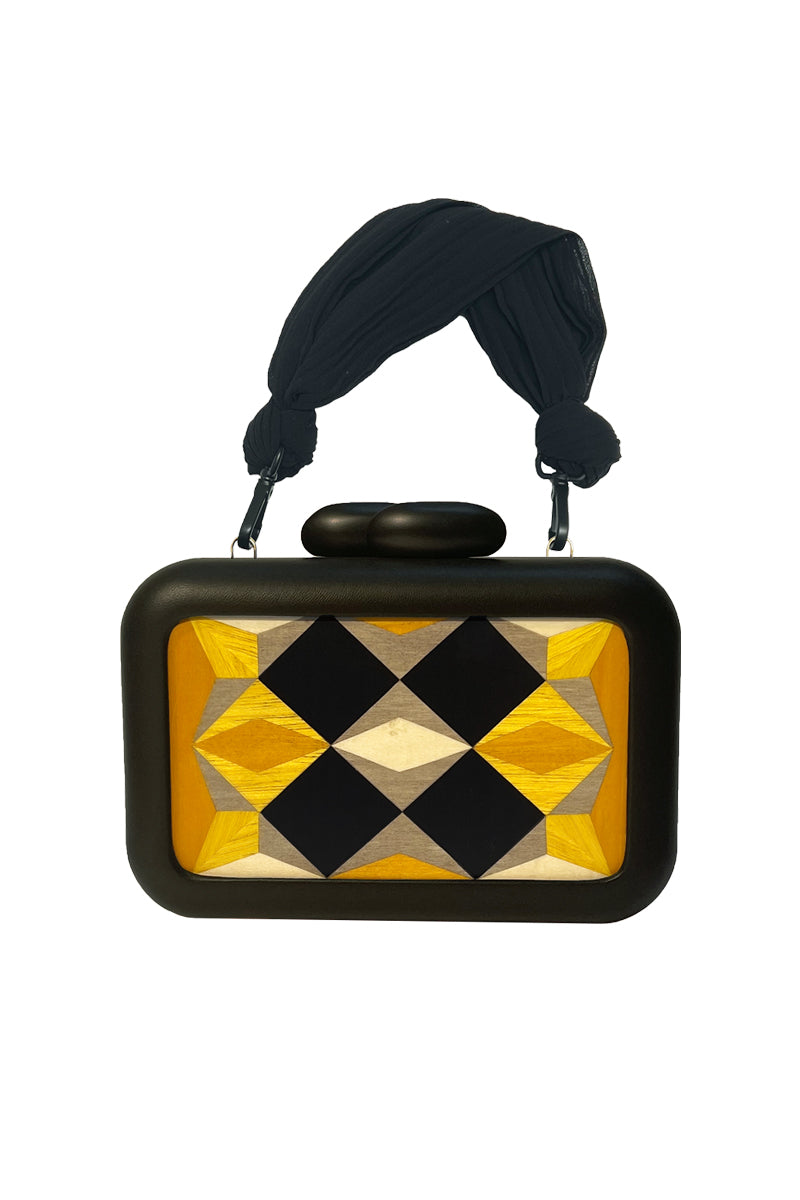 Yellow Simetrís Polygons clutch bag by Sy&Vie featuring a geometric polygon design with a sleek, modern style.