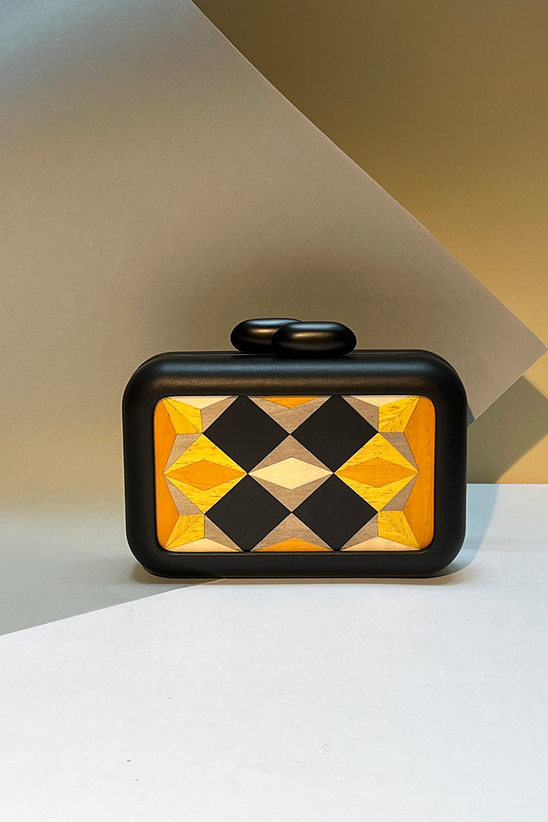 Yellow geometric clutch bag by Sy&Vie featuring polygon designs, perfect for stylish accessories or evening outings.