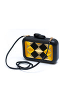 Yellow Sy&Vie clutch with geometric polygon pattern, stylish accessory for evening or casual occasions.