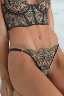Black Ellipse Whispers string thong underwear from Ellipse Lingerie, featuring a sleek, minimal design and thin waistband.