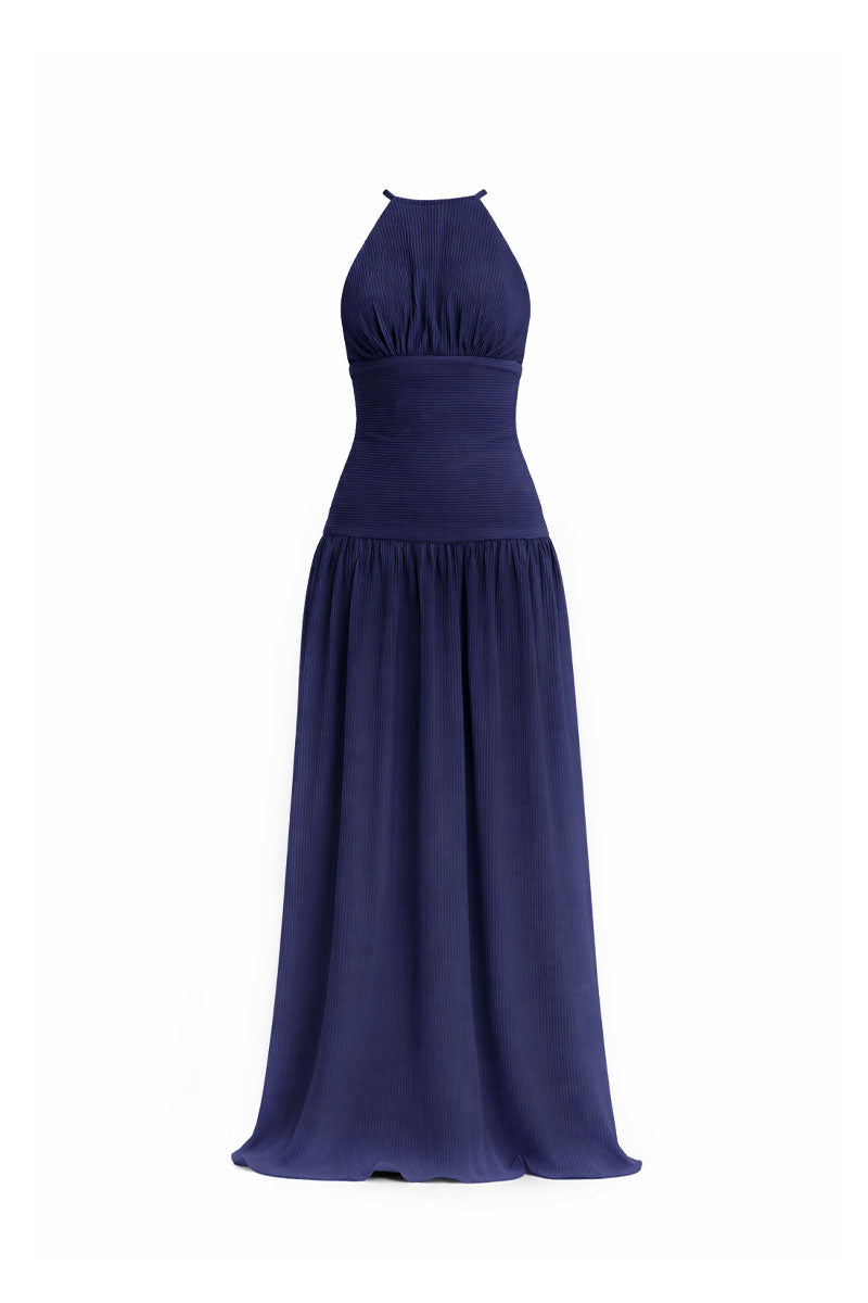 Midnight blue Sirena gown by Maylé Vásquez, elegant maxi dress with flowing fabric and detailed neckline, perfect for formal occasions.