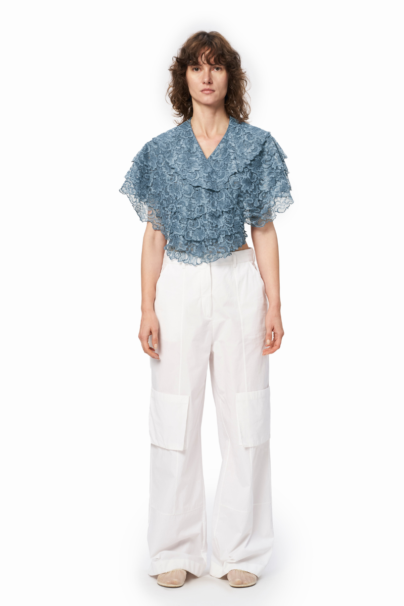 Light blue URA Sisilia top with a relaxed fit, showing the front view of the stylish, casual sleeveless blouse.