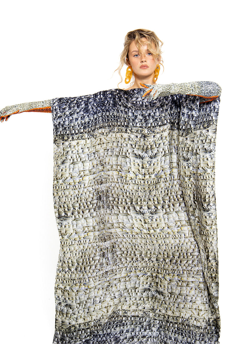 Skin Brocot kaftan maxi dress by Amel Batita, featuring flowing fabric and intricate brocot details, shown with matching gloves.