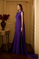 I.H.F Tiana crepe cape gown featuring a sleeveless mermaid silhouette with a long back train, elegant and flowing design.