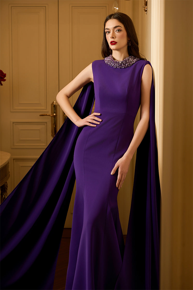 Sleeveless TIANA CREPE CAPE GOWN by I.H.F featuring a mermaid silhouette and a long back train.