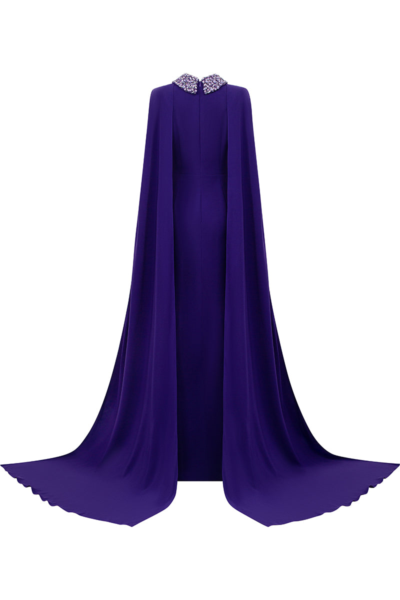 Sleeveless TIANA CREPE CAPE GOWN by I.H.F featuring a mermaid silhouette and a long back train on a formal gown.