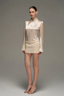 Beige satin shirt and skirt co-ords set by I.H.F Studio, slim-fit shirt with statement cuffs visible in the image.