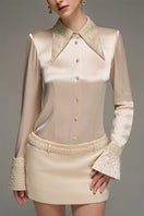 Beige satin shirt and skirt co-ords set by I.H.F Studio, slim-fit shirt with statement cuff visible in the image.