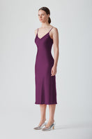 Aubergine MASTANI slip midi dress displayed on a hanger, showcasing smooth fabric and elegant, flowing design.