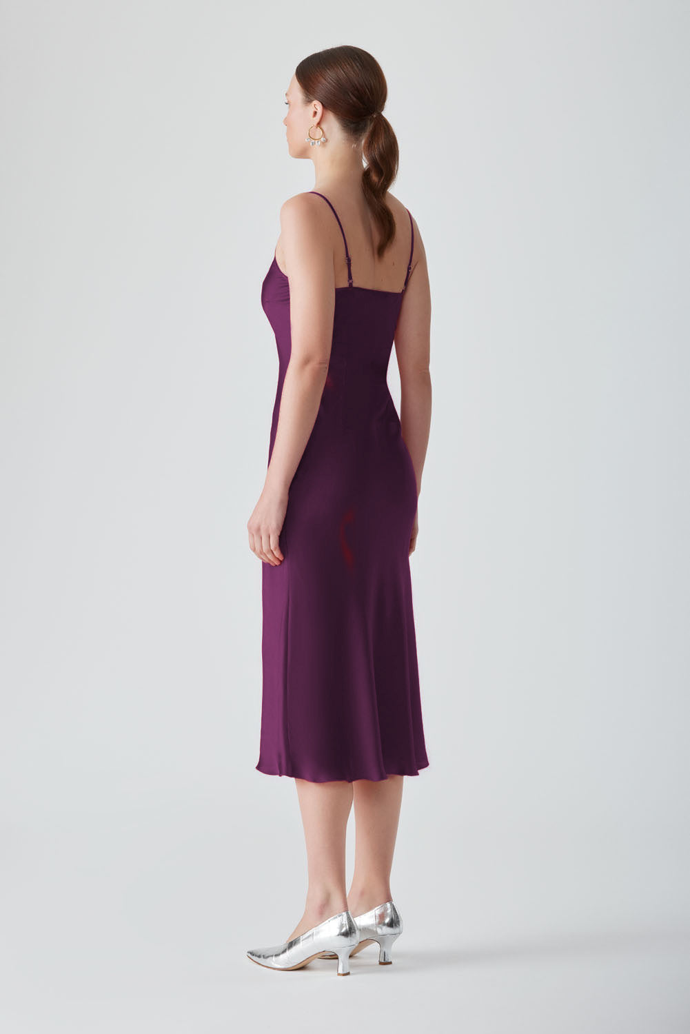 Aubergine MASTANI slip midi dress displayed on a hanger, showcasing its smooth fabric and elegant design.