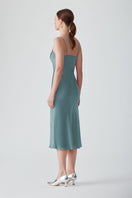 Elegant MASTANI Saxon slip dress in midi length, with smooth fabric and subtle design, perfect for stylish occasions.