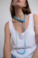Light blue snake totem necklace by Pájara Pinta featuring a detailed guardian snake design on a sleek chain.