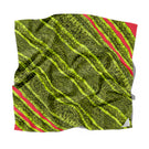 Elegant silk scarf by Amel Batita featuring the SNAQ BROCOT design, showcasing vibrant patterns and luxurious fabric.