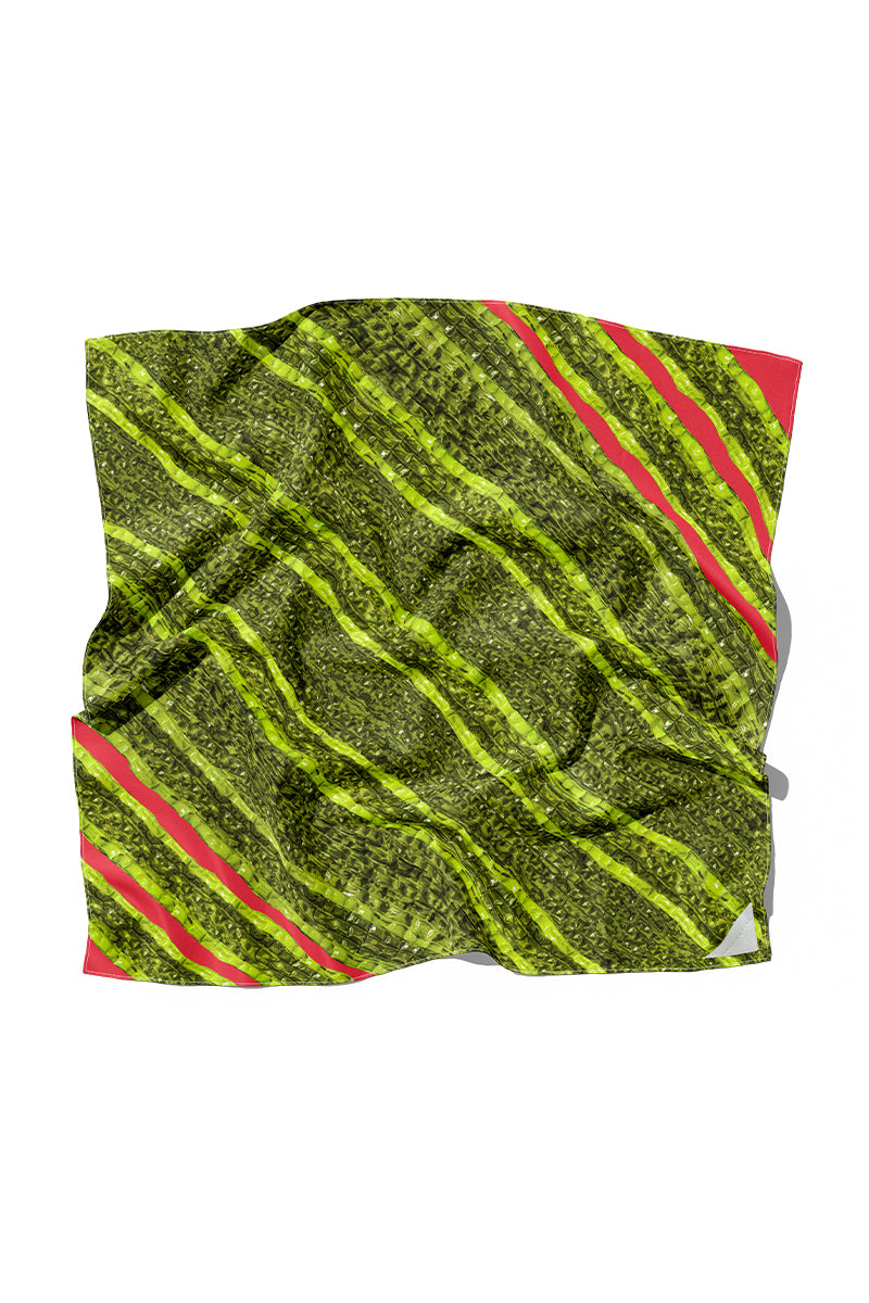 Elegant silk scarf by Amel Batita featuring the SNAQ BROCOT design, showcasing vibrant patterns and luxurious fabric.