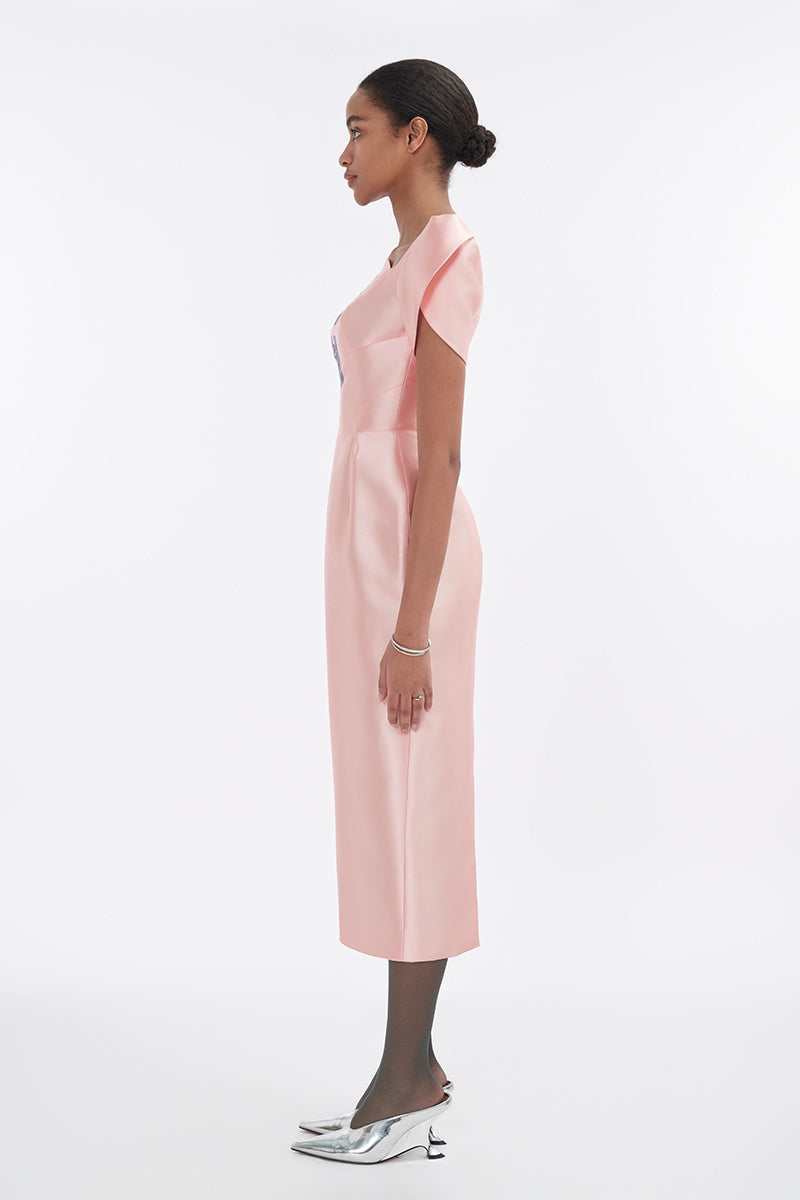 Soft pink orchid sculpted-sleeve pegged midi dress by Tiny Ink, shown on a mannequin with a fitted silhouette and elegant design.